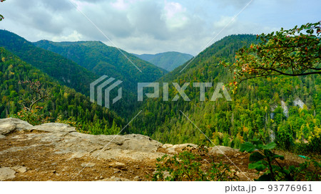 A view of the most beautiful mountains in a panoramic scene. View from Tomasovsky Vyhlad in Slovak Paradise National Park. A blue haze is in the air. 93776961