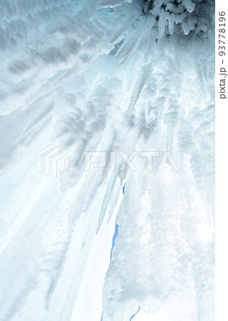 Ice and icicles on the rocks of Ogoy island, Baikal lake, Siberia, Russia. White ice and blue sky abstract winter nature background. Copy space. Ice and icicles on the rocks of Ogoy island, Baikal lake, Siberia, Russia. White ice and blue sky abstract winter nature background. Copy space. 93778196