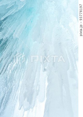 Ice and icicles on the rocks of Ogoy island, Baikal lake, Siberia, Russia. White ice and blue sky abstract winter nature background. Copy space. 93778197