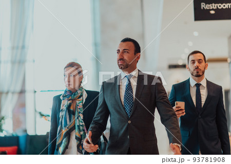 Photo of a business team in suits walking in a modern corporation. Successful business team. Selective focus 93781908