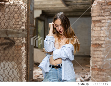 Portrait of young desirable woman in abandoned building 93782335