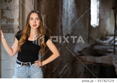 Portrait of attractive woman in abandoned building Portrait of attractive woman in abandoned building 93782529
