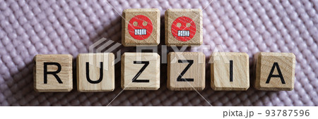 Word Russia with Z symbol on wooden cubes with angry emoticons 93787596