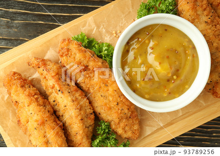 Concept of tasty food with chicken strips, top view Concept of tasty food with chicken strips, top view 93789256