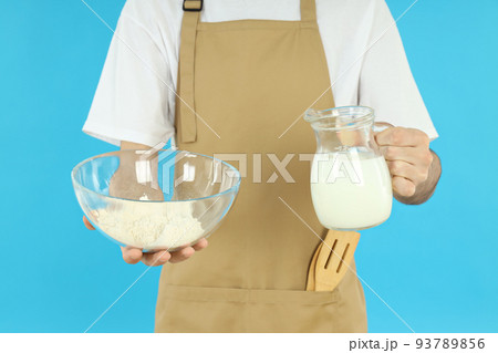 Concept of cooking with young man on blue background Concept of cooking with young man on blue background 93789856