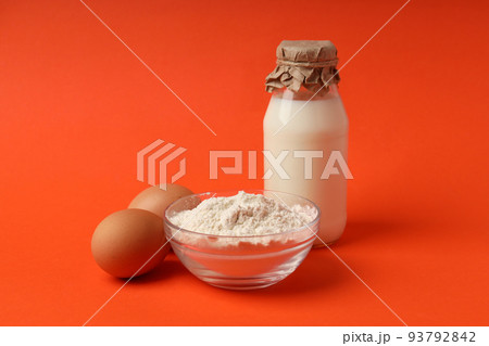 Concept of cooking cake or pie on orange background Concept of cooking cake or pie on orange background 93792842