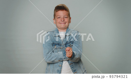 Greedy avaricious aggressive toddler boy child showing fig negative gesture, rapacious, avaricious 93794321