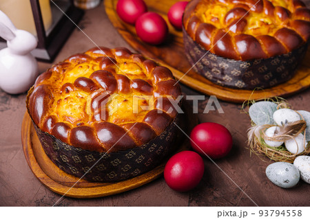 easter bread and eggs on wood 93794558