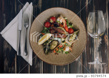 Seafood salad. Traditional spanish dish on wood Seafood salad. Traditional spanish dish on wood 93794574