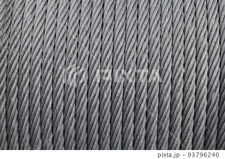 Steel rope is on a winch, close up, abstract industrial background Steel rope is on a winch, close up, abstract industrial background 93796240