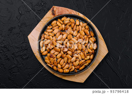 Organic roasted salty peanuts in a pan Organic roasted salty peanuts in a pan 93796418