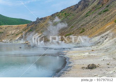 hot mineralized lake with thermal spring and smoking fumaroles in the caldera of the Golovnin volcano on the island of Kunashir 93797012