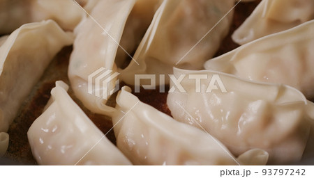 Grilling japanese dumpling on fry pan Grilling japanese dumpling on fry pan 93797242
