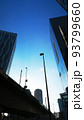 東京都内のビル群と街灯と青空の夕暮れ時の都市景観 93799660