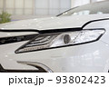 New modern unknown car with elegant head lamps. 93802423