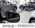 New unknown cars at dealer showroom. Blur effect. 93802424