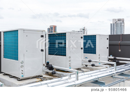 Air conditioner compressor installed on roof building.  93805466