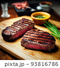 ribeye steak on wooden board 93816786