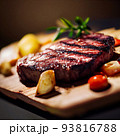 grilled ribeye steak on wooden board 93816788