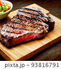 grilled ribeye steak on wooden board 93816791
