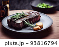 delicious beef steak on black plate served with rosemary 93816794