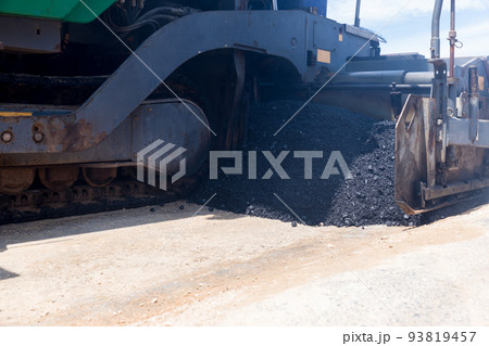 Paver machine on a new asphalt road surface. Paver machine on a new asphalt road surface. 93819457