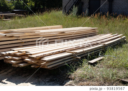 Folded finished boards at the sawmill closeup Folded finished boards at the sawmill closeup 93819567