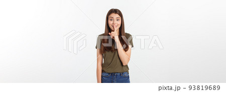 Beautiful woman showing finger over lips isolated on a white background. 93819689