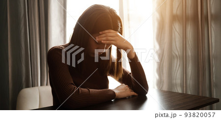 woman sit Depression Dark haired  pensive glance Standing by window and anxiety Copy space. . 93820057