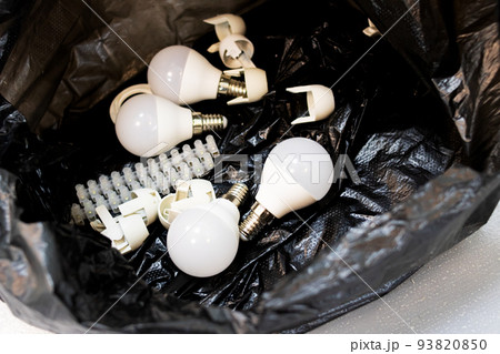 A bunch of light bulbs in a black bag A bunch of light bulbs in a black bag 93820850