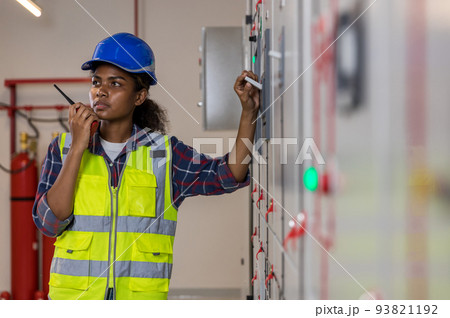 Electrical engineer working in control room. Electrical engineer working in control room. 93821192