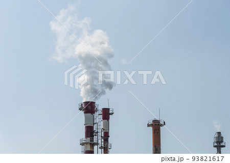 Air pollution by smoke coming out of two factory chimneys. Air pollution by smoke coming out of two factory chimneys. 93821617