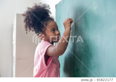 Kid write on chalk board. Back to school. Schoolchild in class. Happy kid writing green blackboard. Kid write on chalk board. Back to school. Schoolchild in class. Happy kid writing green blackboard. 93822177