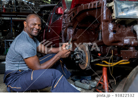 Mechanic checking and replacement of ventilated automobile brake discs. brake system repair. Mechanic checking and replacement of ventilated automobile brake discs. brake system repair. 93822532