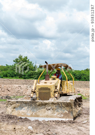 Engineer or Worker operator driving excavator on construction building site 93831287