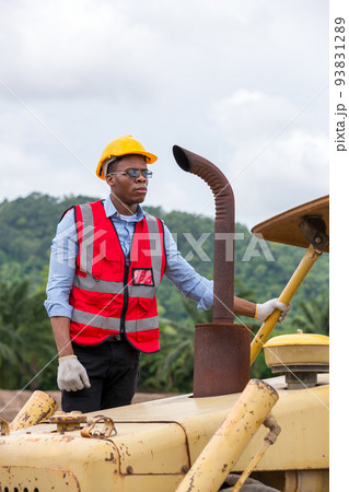 Engineer or Worker operator driving excavator on construction building site 93831289