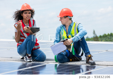 Engineer working setup Solar panel at the roof top.  93832106