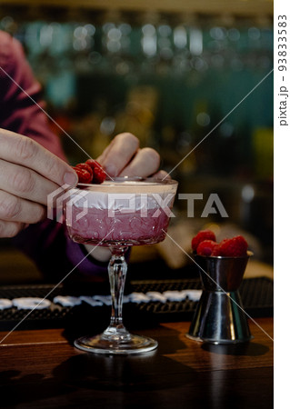 pink cocktail with a layer of white foam 93833583