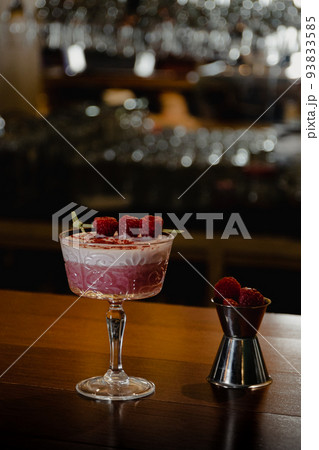 pink cocktail with a layer of white foam 93833585