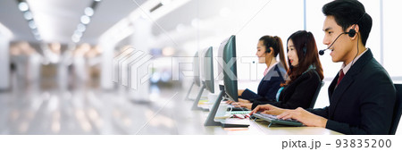 Business people wearing headset working in office in widen view Business people wearing headset working in office in widen view 93835200