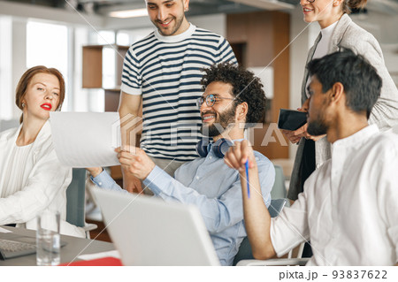 Busy coworkers cooperating and working together at office meeting, teamwork concept 93837622