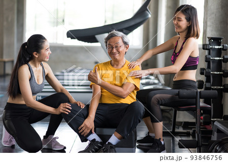 Smiling old man thumb up being massage by women Smiling old man thumb up being massage by women 93846756