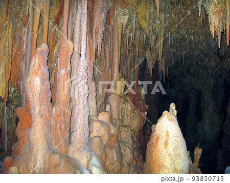 Petralona cave, Creece- may 25, 2007: Ancient karst cave with stalactites and stalagmites, Cenote ceiling and limestone decoration. Petralona cave, Creece- may 25, 2007: Ancient karst cave with stalactites and stalagmites, Cenote ceiling and limestone decoration. 93850715