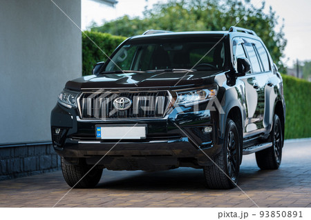 Kyiv, Ukraine - August 23th 2022: Toyota Land Cruiser Prado in black color Kyiv, Ukraine - August 23th 2022: Toyota Land Cruiser Prado in black color 93850891