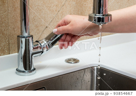 The concept of lack of tap water. The faucet has no running water The concept of lack of tap water. The faucet has no running water 93854667