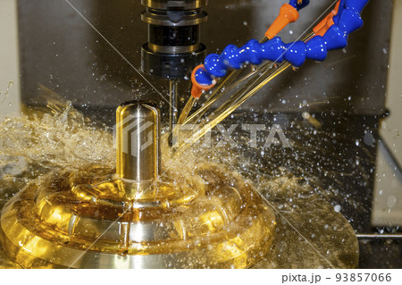 The CNC milling machine cutting the brass material part with oil coolant method. The CNC milling machine cutting the brass material part with oil coolant method. 93857066