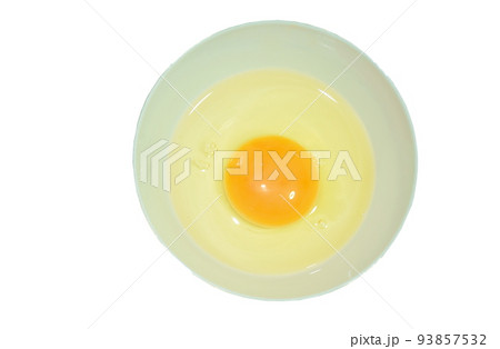raw yolk and white egg cracked from shell in cup raw yolk and white egg cracked from shell in cup 93857532
