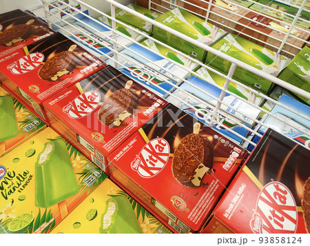 JOHOR, MALAYSIA - MARCH 5, 2022: Ice cream sticks packed in bulk in boxes and stored in the freezer. Displayed for sale in supermarkets. Has a price tag. 93858124