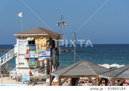 Lifeguard booth stands at the shore line on the beach 93860184