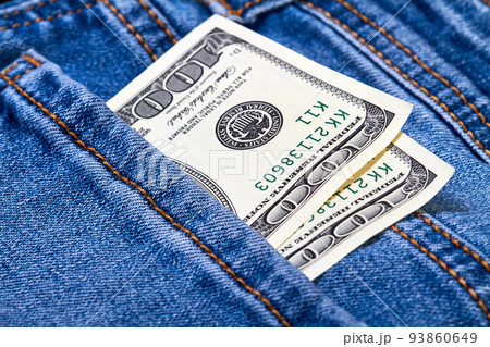 Hundred dollar bills in jeans pocket 93860649